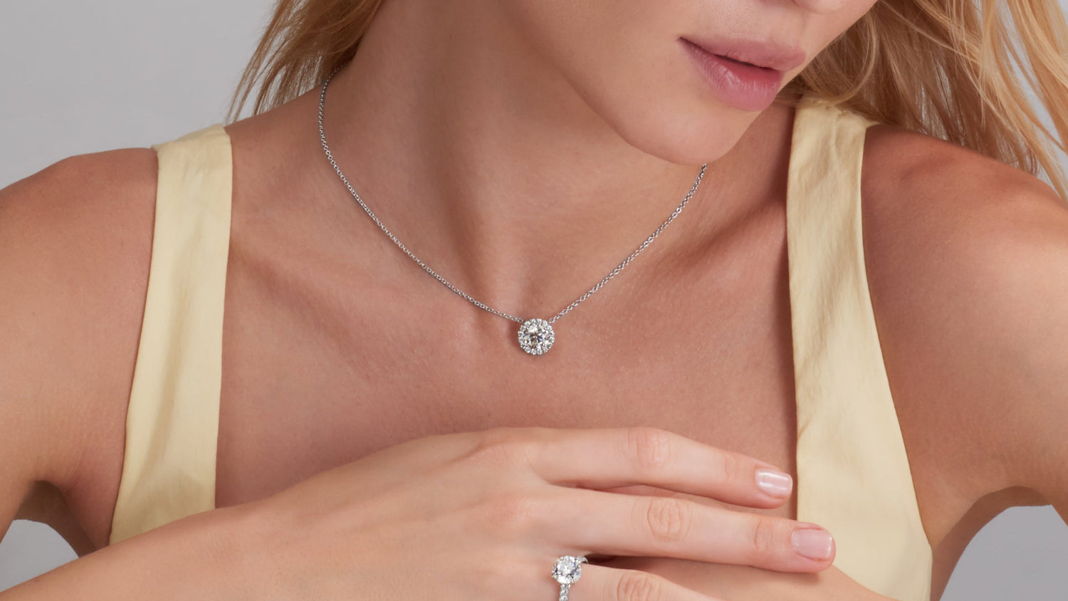 Diamond halo necklace and ring set from the Halo Jewelry collection at Edward's Jewelry