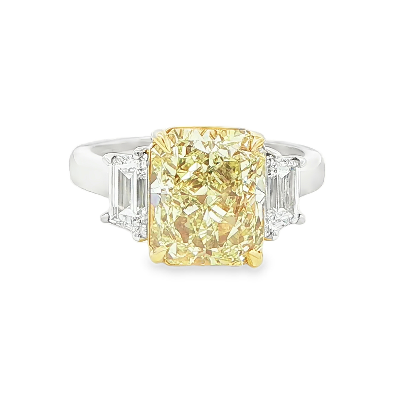 4.12 CT radiant cut fancy intense yellow diamond three stone ring front view