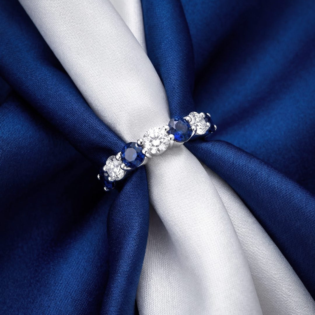 2.9 CT Alternating Round Brilliant Blue Sapphire and Diamond Halfway Ring in Platinum, worn on model, view 1 - fine jewelry in San Francisco