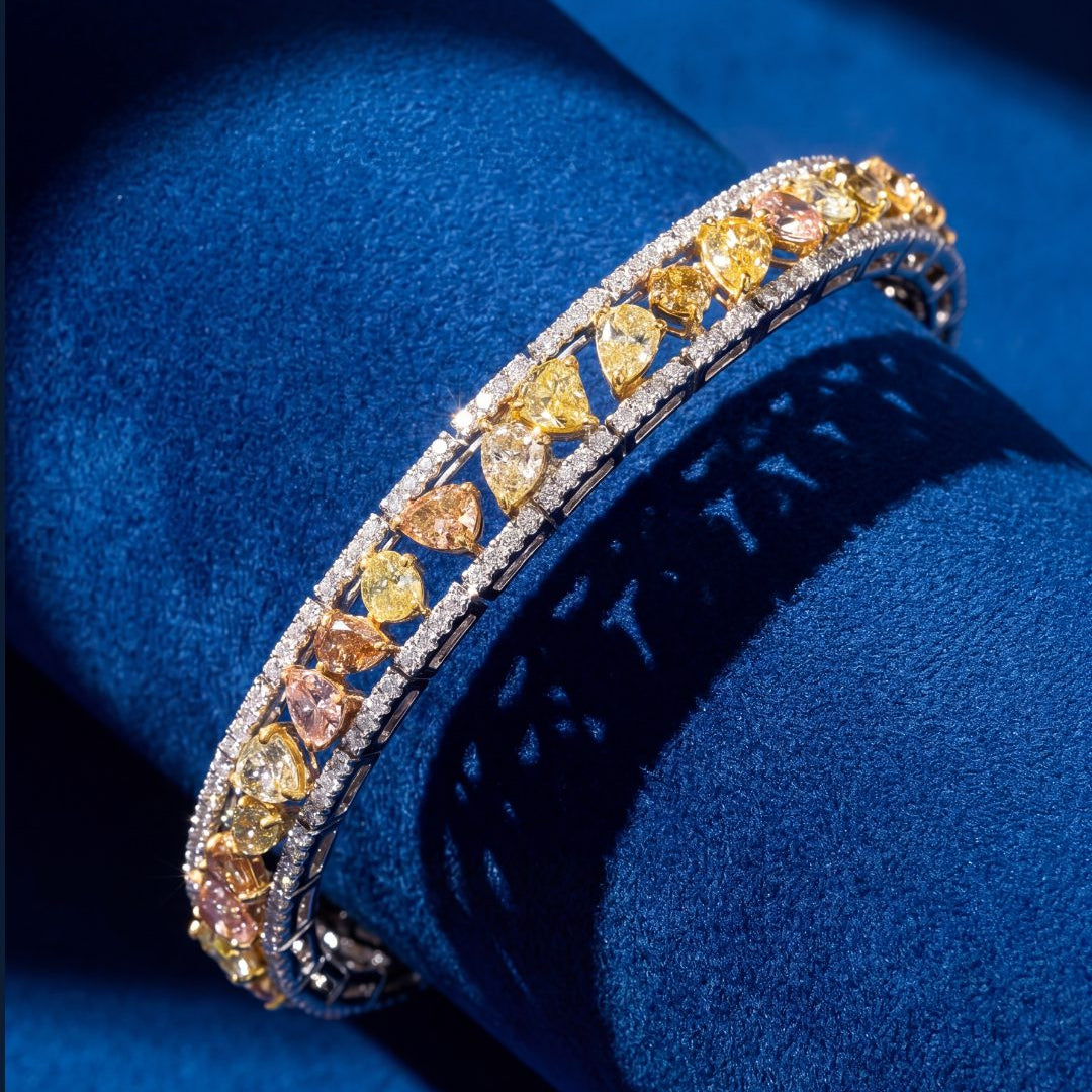 8.00ct Fancy Color Diamond Bracelet in 18K White and Yellow Gold, worn on model - fine jewelry in San Francisco