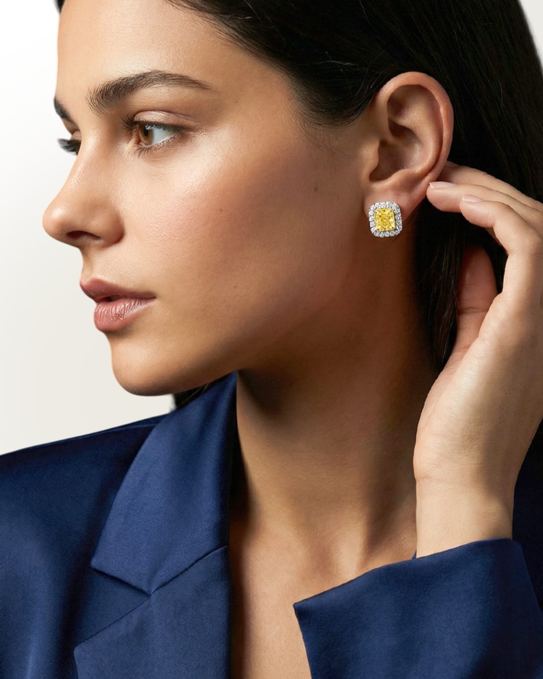 2.67 CT Fancy Yellow Diamond & Round Brilliant Diamond Halo Stud Earrings in 14K White Gold, worn on model, view 1 - fine jewelry in San Francisco