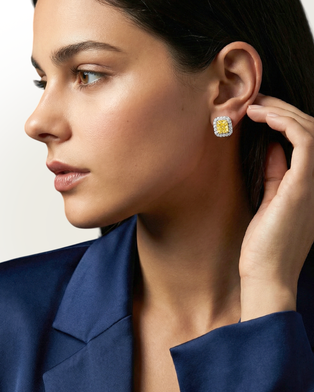 2.67 CT Fancy Yellow Diamond & Round Brilliant Diamond Halo Stud Earrings in 14K White Gold, worn on model, view 1 - fine jewelry in San Francisco