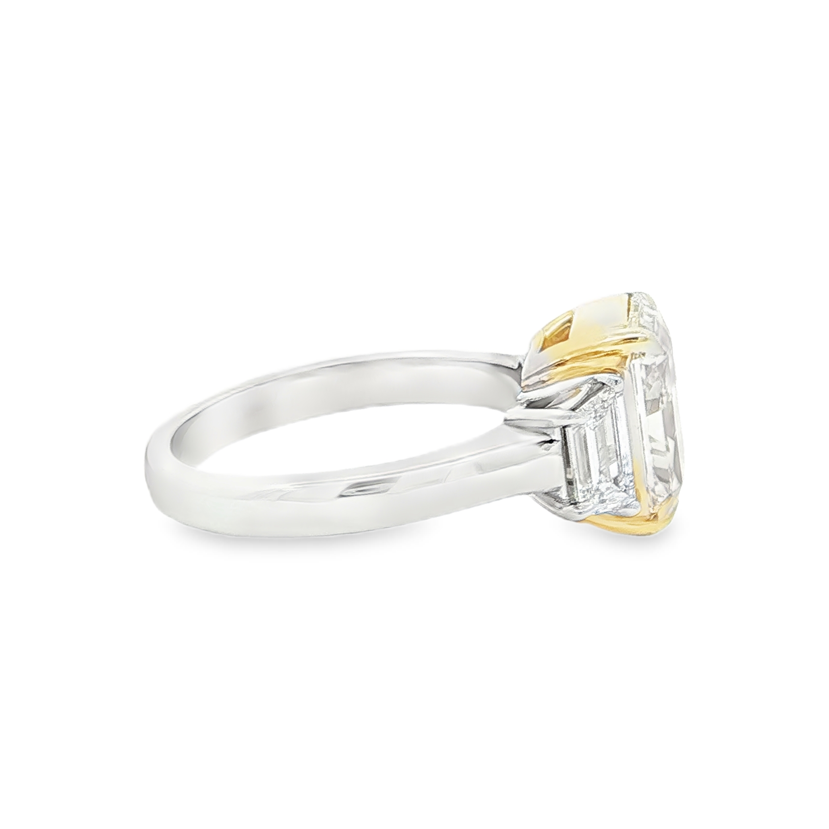 Radiant cut yellow diamond three stone ring detail view
