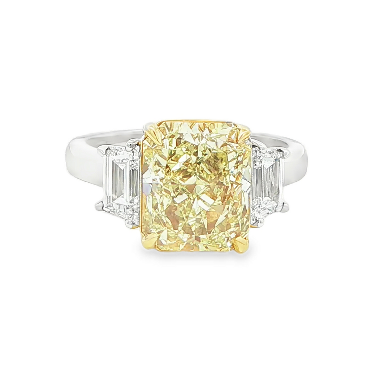 4.12 CT radiant cut fancy intense yellow diamond three stone ring front view