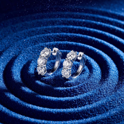 4.26 CT. Round Brilliant Three Stone Diamond Huggie Earrings in 14K White Gold on model - Edward&