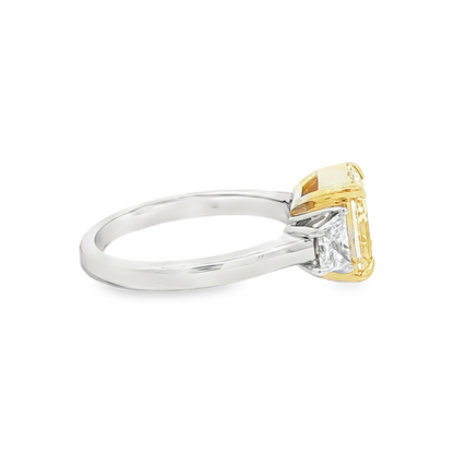 Radiant cut yellow diamond and trapezoid diamond ring detail view