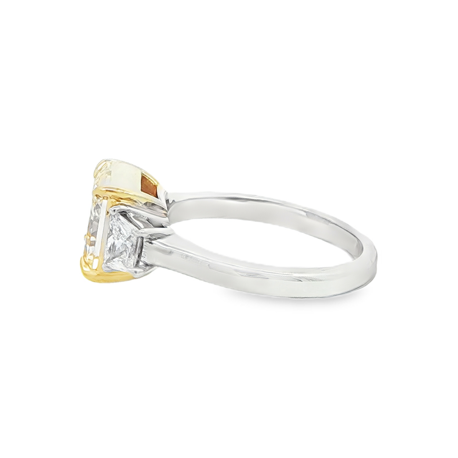 Fancy intense yellow diamond ring with trapezoid cut side diamonds
