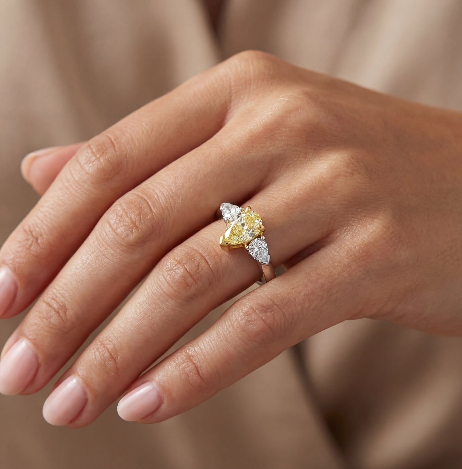 1.35 CT. Three Stone Ring with Fancy Light Yellow Marquise and White Pear Diamonds in 18K Yellow Gold and Platinum