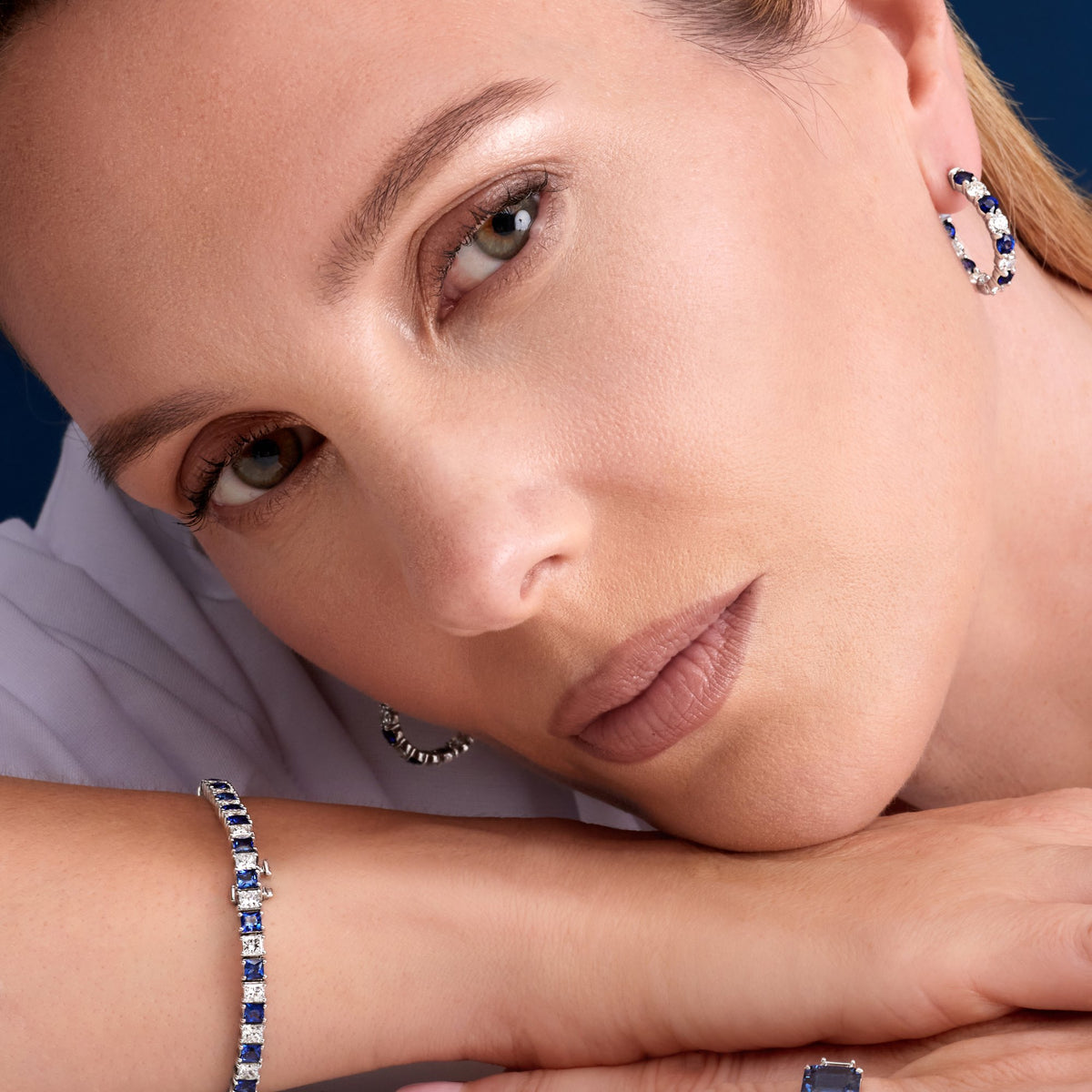 11.26 CT Alternating Princess Cut Blue Sapphire and Diamond Tennis Bracelet in 14K White Gold, worn on model, view 2 - fine jewelry in San Francisco