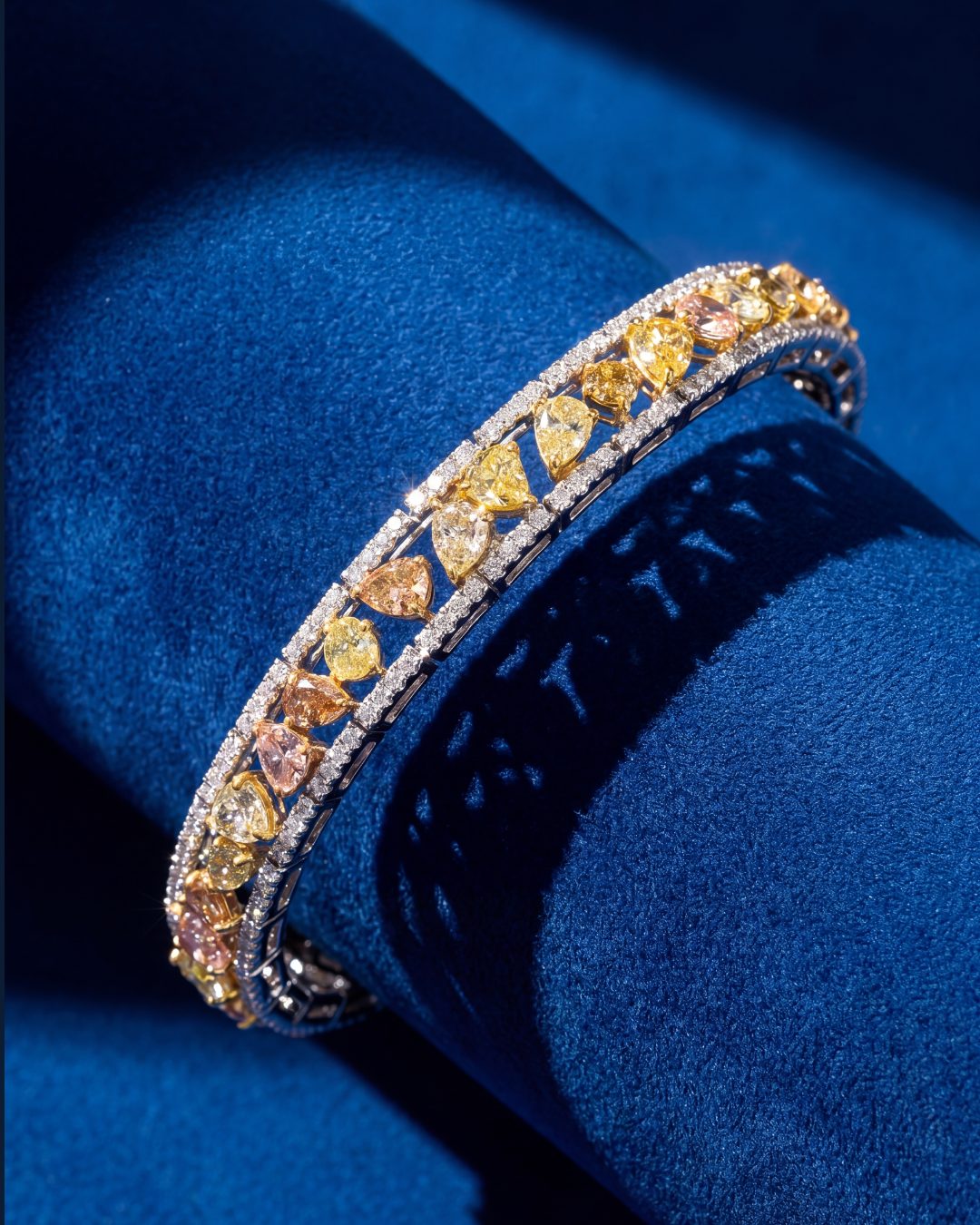 8.00ct Fancy Color Diamond Bracelet in 18K White and Yellow Gold, worn on model - fine jewelry in San Francisco