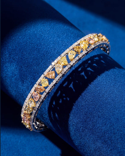 8.00ct Fancy Color Diamond Bracelet in 18K White and Yellow Gold, worn on model - fine jewelry in San Francisco