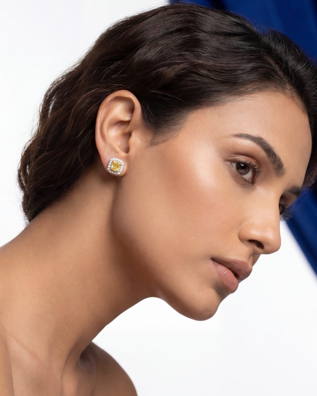 2.67 CT Fancy Yellow Diamond &amp; Round Brilliant Diamond Halo Stud Earrings in 14K White Gold, worn on model, view 2 - fine jewelry in San Francisco