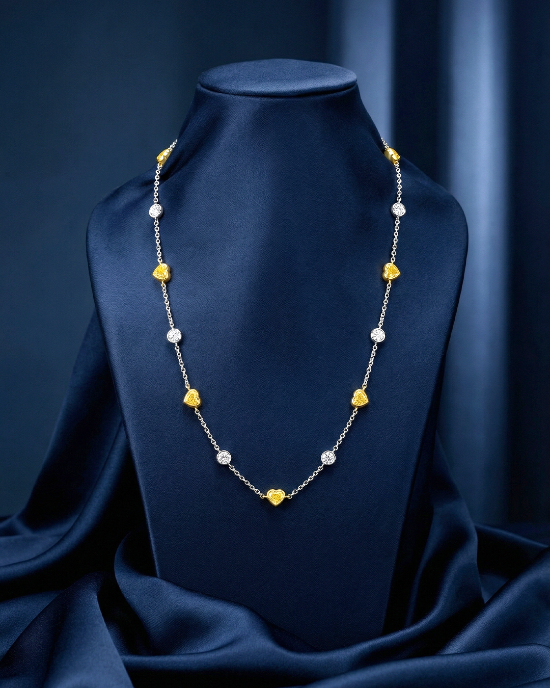 5.82 CT Heart Shape Fancy Yellow Diamond and Round Brilliant Diamond Necklace in 18K White Gold and Yellow Gold, worn on model, view 1 - fine jewelry in San Francisco