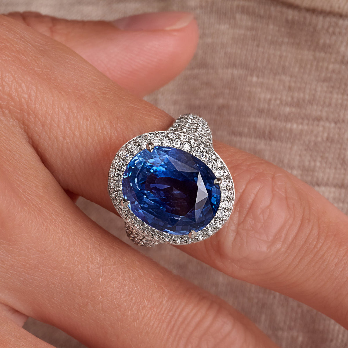 12.35 CT. Oval Cut Blue Sapphire and Round Brilliant Halo Diamond Ring in Platinum - worn on model