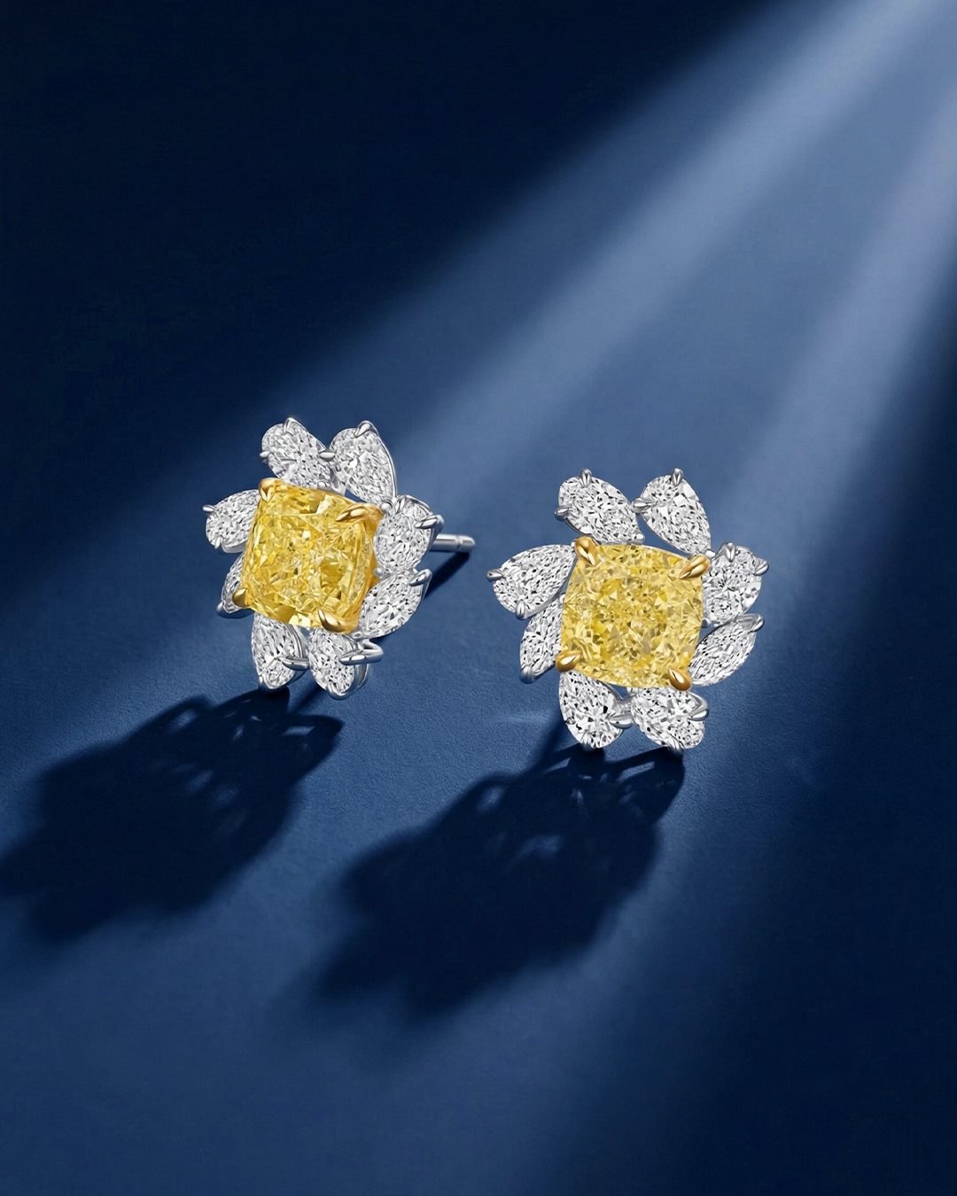 6.14 CT Pear and Cushion Cut Fancy Yellow Diamond Flower Stud Earrings, worn on model - fine jewelry in San Francisco