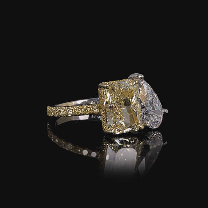 5.84 CT. Radiant Cut Fancy Yellow Diamond &amp; Pear Cut Diamond Toi et Moi Ring with Pavé Band in Yellow Gold and Platinum