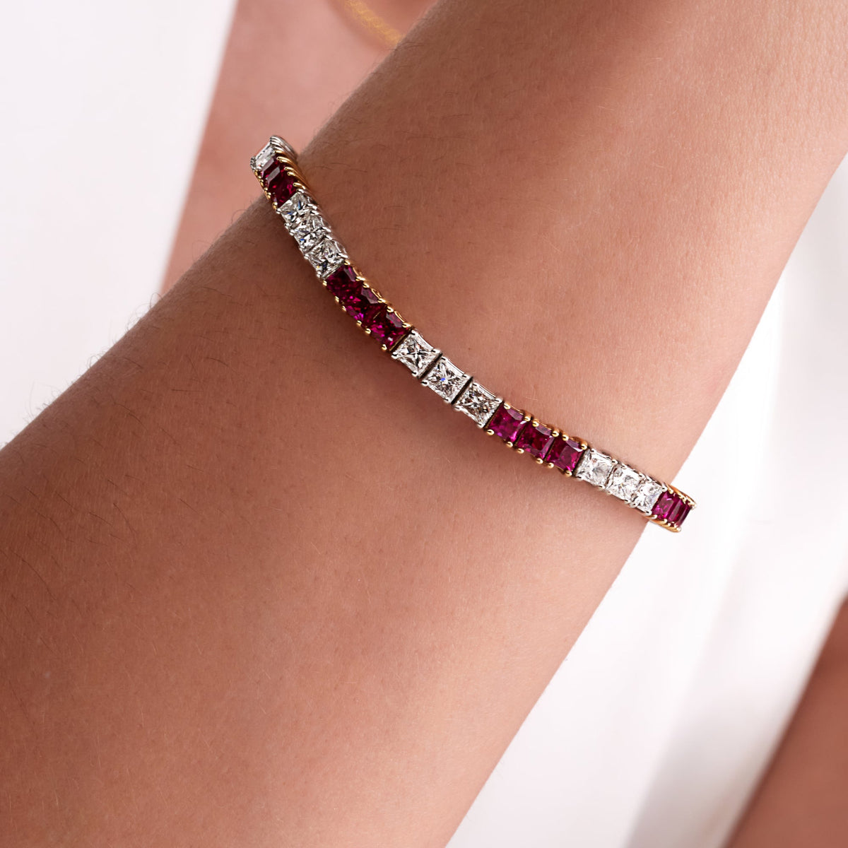 10.48 CT. Princess Cut Ruby and Diamond Tennis Bracelet in 14K White Gold and Yellow Gold - worn on model