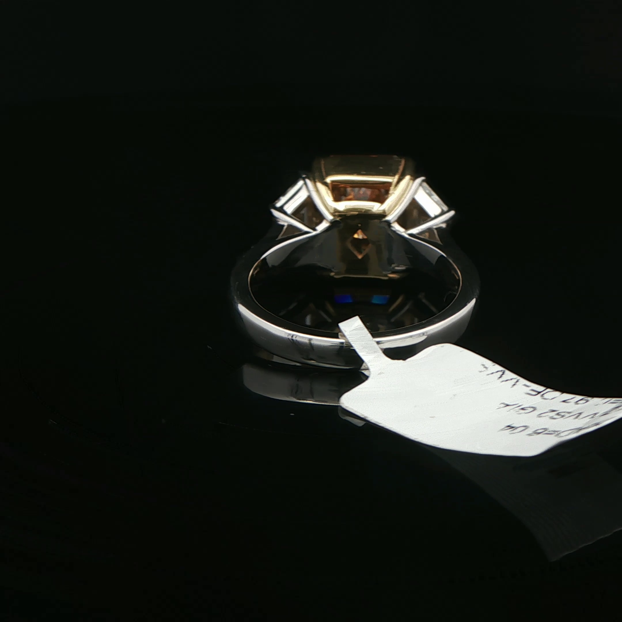 Yellow diamond ring with trapezoid diamonds detail