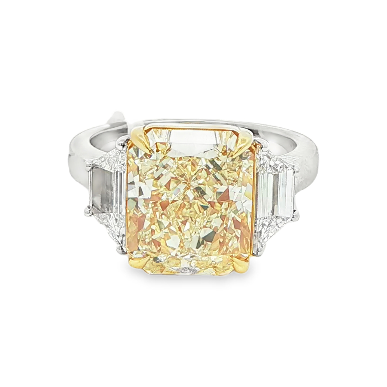 Radiant cut yellow diamond ring with trapezoid side diamonds front view