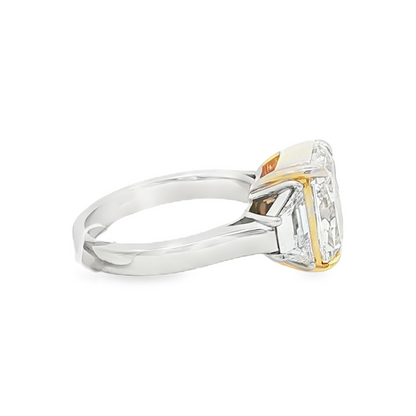 Three stone yellow diamond ring angled side view