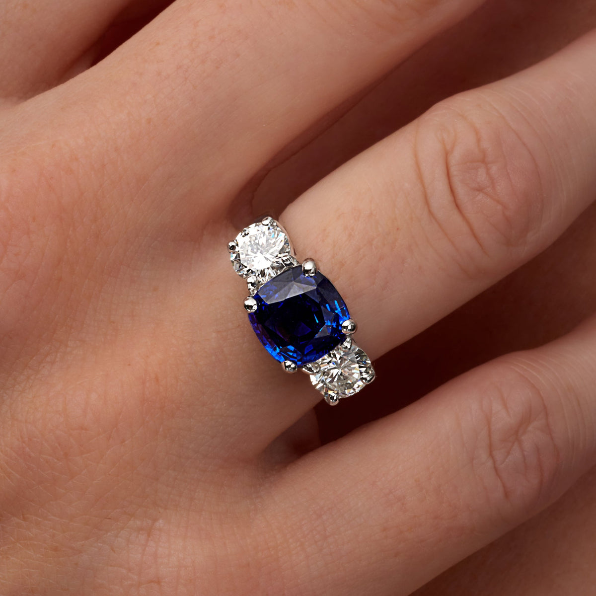 5.85 CT. Sapphire and Round Brilliant Diamond Three Stone Ring in Platinum - worn on model