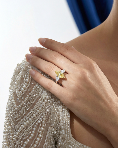 2.46 CT Three Stone Ring with Fancy Light Yellow Marquise and Pear Diamonds in 18K Yellow Gold and Platinum, worn on model, view 1 - fine jewelry in San Francisco