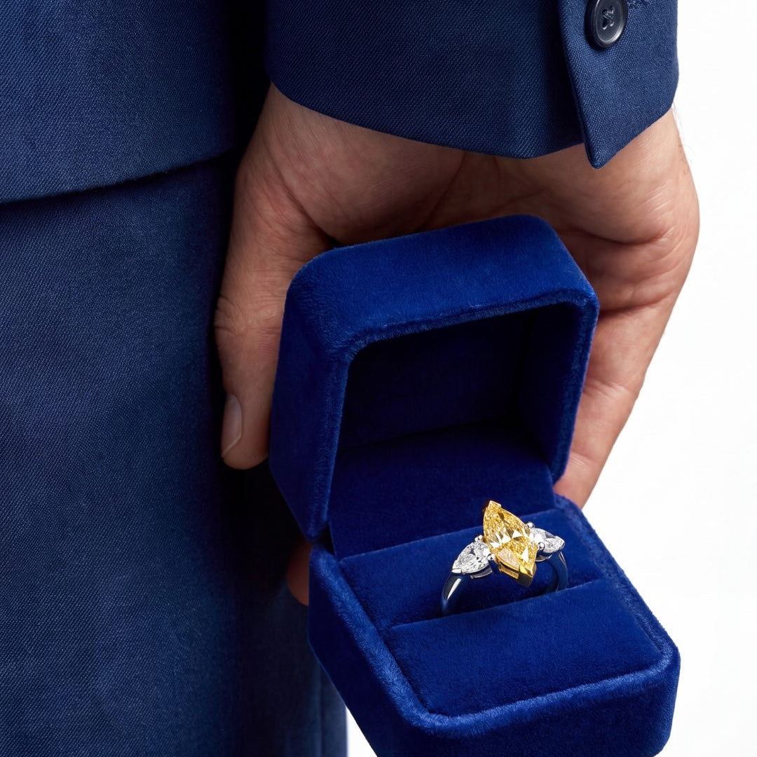 2.46 CT Three Stone Ring with Fancy Light Yellow Marquise and Pear Diamonds in 18K Yellow Gold and Platinum, worn on model, view 2 - fine jewelry in San Francisco