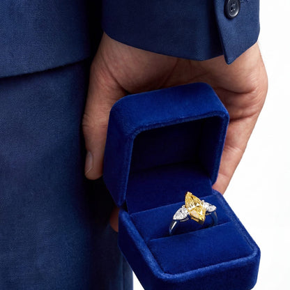 2.46 CT Three Stone Ring with Fancy Light Yellow Marquise and Pear Diamonds in 18K Yellow Gold and Platinum, worn on model, view 2 - fine jewelry in San Francisco