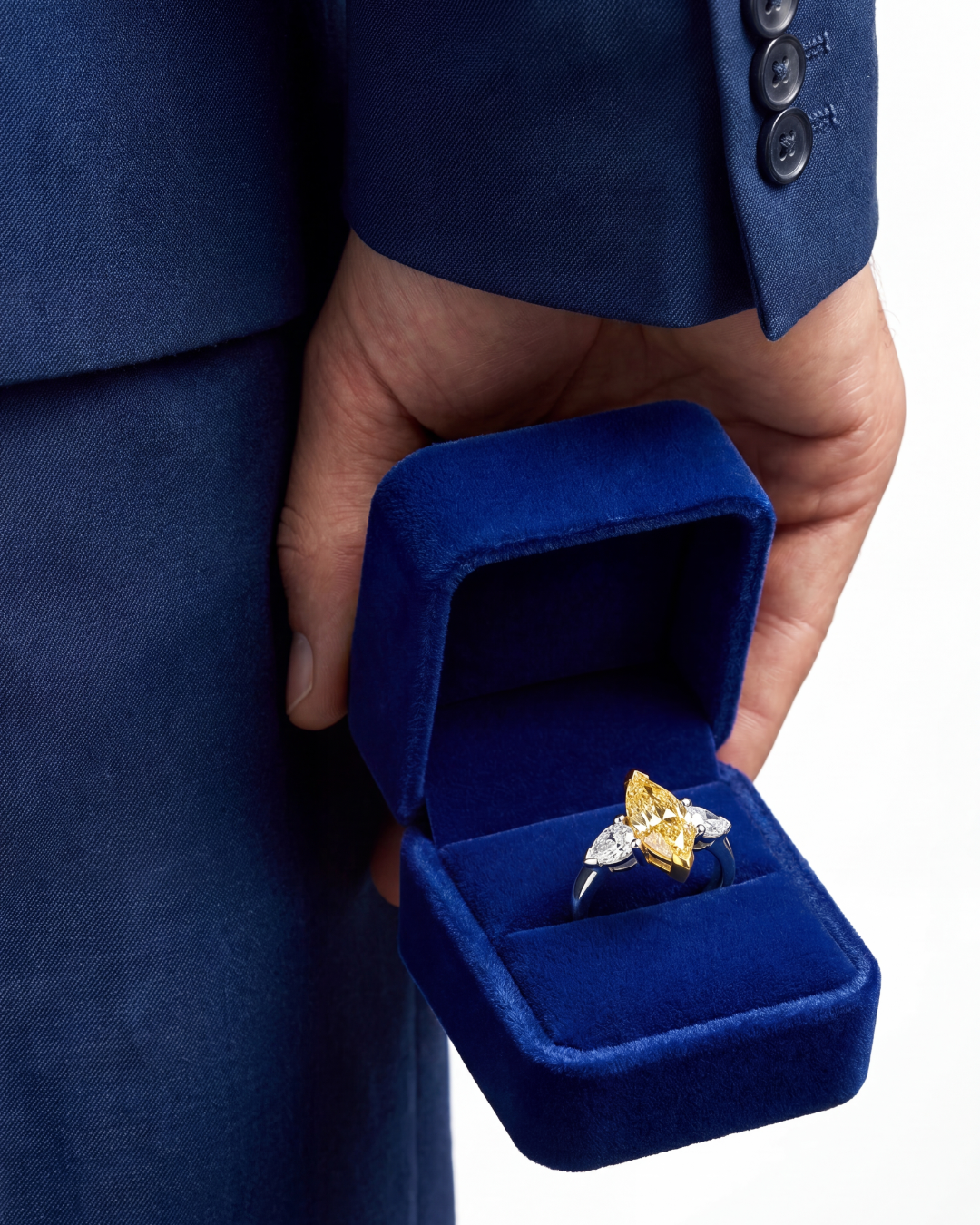 2.46 CT Three Stone Ring with Fancy Light Yellow Marquise and Pear Diamonds in 18K Yellow Gold and Platinum, worn on model, view 2 - fine jewelry in San Francisco