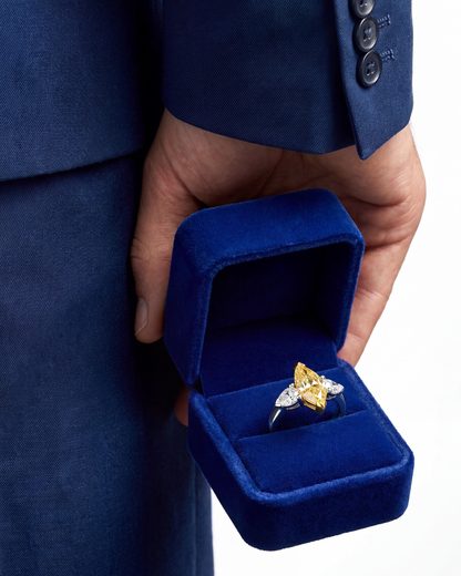 2.46 CT Three Stone Ring with Fancy Light Yellow Marquise and Pear Diamonds in 18K Yellow Gold and Platinum, worn on model, view 2 - fine jewelry in San Francisco