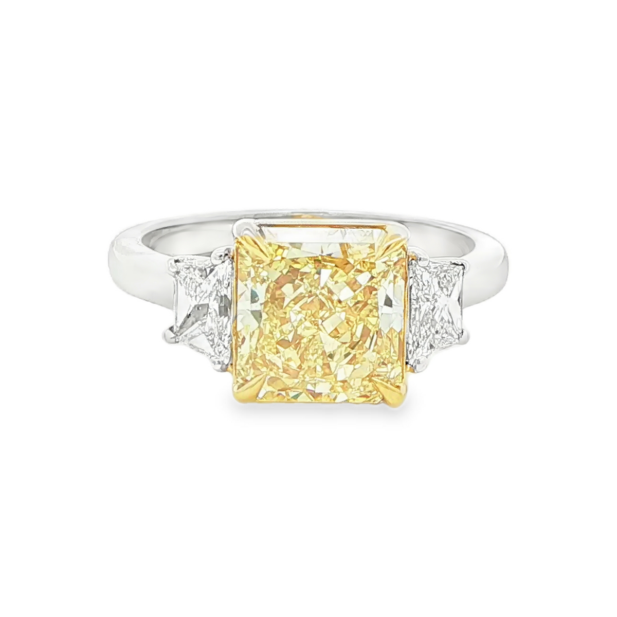 3.00 CT radiant cut fancy intense yellow diamond three stone ring front view